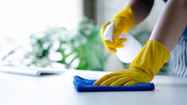 Cleaner sanitising a surface